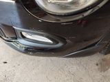 a close up of the front bumper of a car