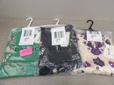 three pairs of women ' s clothing are wrapped in plastic bags