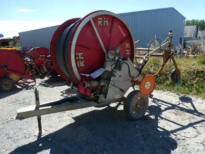 an image of a large red hose on a trailer