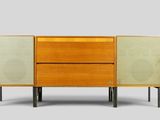 an image of a wooden cabinet with two speakers on top of it