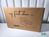a cardboard box that has a baby rocker in it