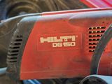 a red driller sitting on top of a red car