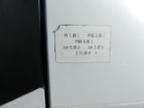 a close up of a white refrigerator with a price label on it