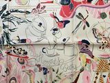 an open book with drawings on it on a table