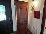 a wooden door in the corner of a room
