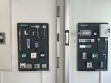 two telephones on the wall next to each other