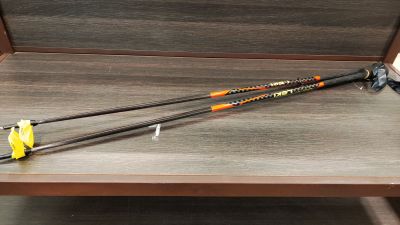 a pair of ski poles sitting on a wooden bench