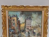 une image d'une peinture représentant une scène de rue dans un cadre doré