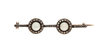 a close up of a pair of cuff bracelets with white stones