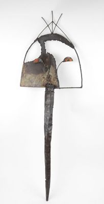 sculpture of a knife with a large blade on top of it