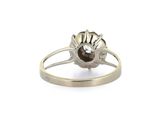 silver ring with a flower and a stone in the middle