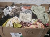 a cardboard box filled with clothes and other items