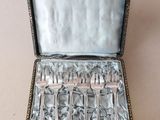 silverware in a silver case on a white surface
