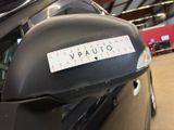 a close up of a car with a sticker on it ' s side mirror