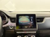 a picture of a car dashboard with a monitor and steering wheel