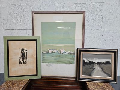 three framed pictures sitting on a table next to each other