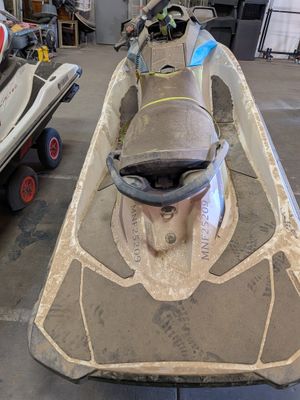 a small boat that is sitting in the garage