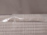 a stack of folded towels sitting on a table