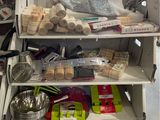 a shelf with various items on it in a kitchen