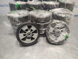 a lot of tires that are wrapped up on a table
