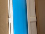 a blue and white container in a cardboard box
