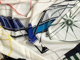 un gros plan sur une écharpe ornée de nombreux motifs différents
