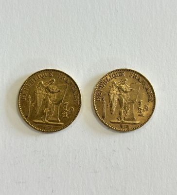 two gold coins, one of which is a woman and one of which is a man
