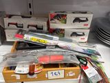 boxes of assorted items are stacked on a shelf in a kitchen