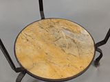 an image of a table with a marble top and iron legs