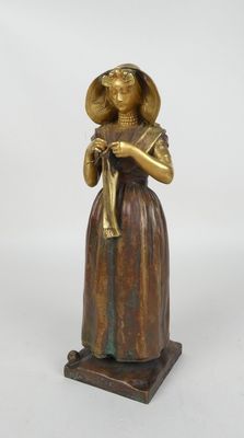 une image représentant une statue d'une femme portant un chapeau et une canne