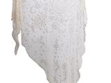 an image of a white shawl hanging on a white wall