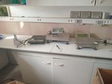 an image of a kitchen with a lot of clutter on the counter