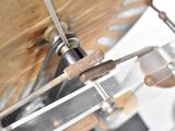 a close up of a metal object with a wooden handle