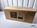 a box of black toner cartridges sitting on top of a white table