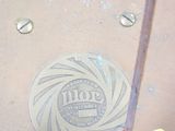 a pink bag with a silver logo on the side of it