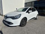 the white car is parked in front of a building