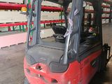a red forklift truck parked in a warehouse