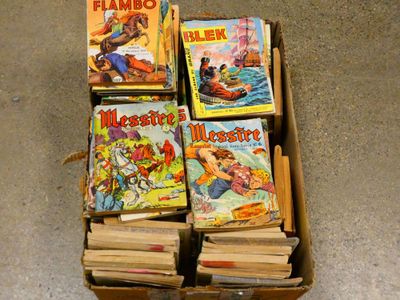 de nombreux livres qui se trouvent dans une boîte posée par terre