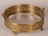 a gold plate with a circular design on it