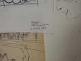 sketches of a drawing of a car and a sign on a wall