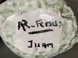 a stone with writing on it sitting on a table