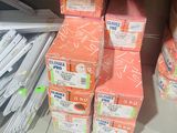 many boxes of toilet paper on the shelf in the store