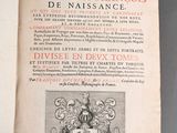 an open book with a picture of a coat of arms and a coat of arms on it