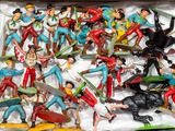 a box full of toy figurines of different types