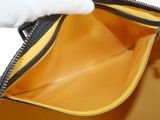 the inside of a yellow purse with a zipper on it