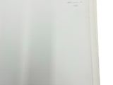 a white book with a picture of a cat on it