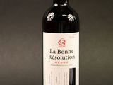 a bottle of wine that is sitting on a table
