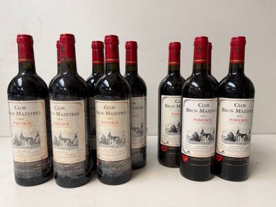 six bottles of red wine are lined up on a table
