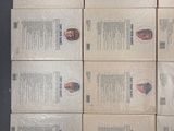 six boxes of pizza sitting on top of a table next to each other