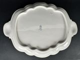 a white plate with a flower design on it